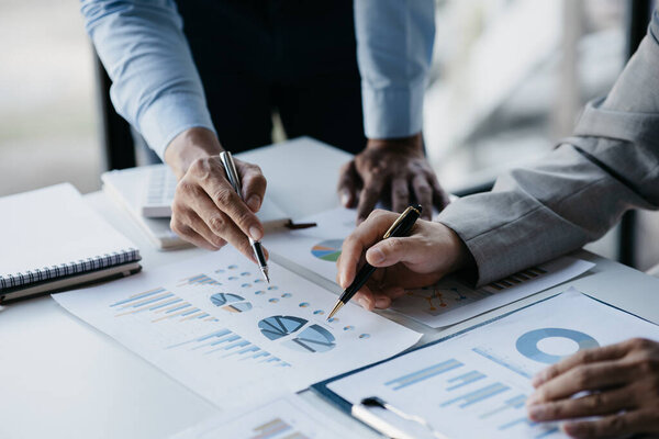 The sales department is having a monthly summary meeting to bring it to the department manager, they are verifying the correctness of the documents that are prepared before bringing in to the manager