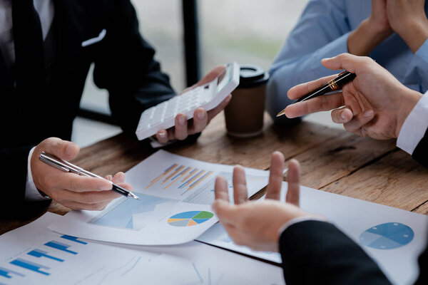 The sales department is having a monthly summary meeting to bring it to the department manager, they are verifying the correctness of the documents that are prepared before bringing in to the manager