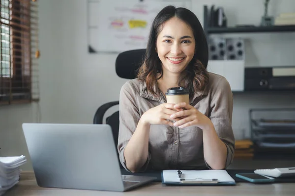 Beautiful Asian woman is a businesswoman who leads a new generation of startups, a woman who runs and manages a business plan to build confidence and stability in business, woman-led business concept.