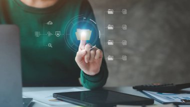 business man with holograms of digital document files, data files on computers stored as cloud databases can be viewed online and prevented data loss from the device. Data file management concept.