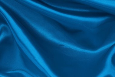 Koyu mavi kumaş dokusu arka plan, ipeğin veya keten deseninin ayrıntıları.