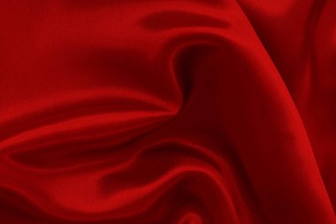 Koyu kırmızı kumaş dokusu arka plan, ipeğin veya keten deseninin ayrıntıları.