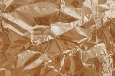 Kahverengi folyo dokusu, buruşuk ve dalgalı ambalaj kağıdı deseni.