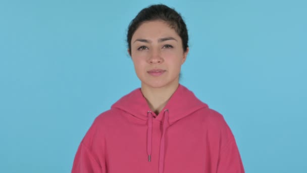 Serious Indian Girl Looking at the Camera , Blue Background — Stock Video