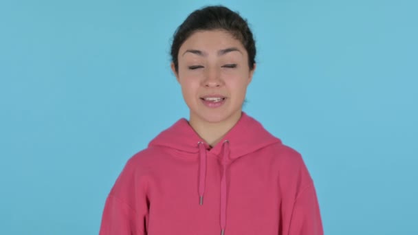 Indian Girl Pointing at the Camera , Blue Background — Stock Video