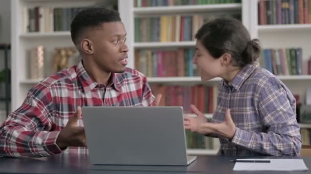 African Man and Indian Woman Arguing while Working on Laptop — Stock Video