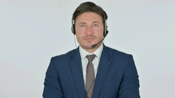 Geschäftsmann mittleren Alters mit Headset, weißem Hintergrund — Stockfoto