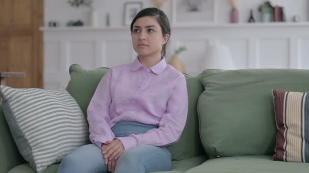 Indian Woman Sitting on Sofa Thinking — Stock Video