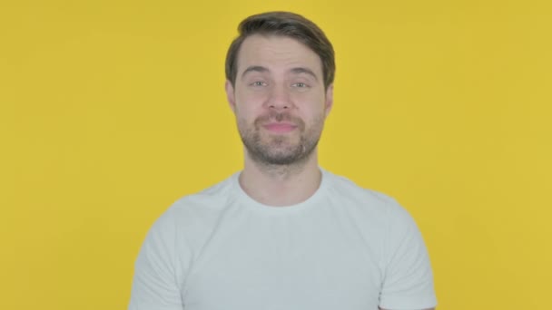 Casual Young Man Waving Hand Say Hello Yellow Background — Stockvideo