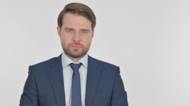 Young Adult Businessman Pointing on Side on White Background 