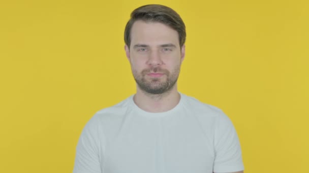 Smiling Casual Young Man Yellow Background — Stock video