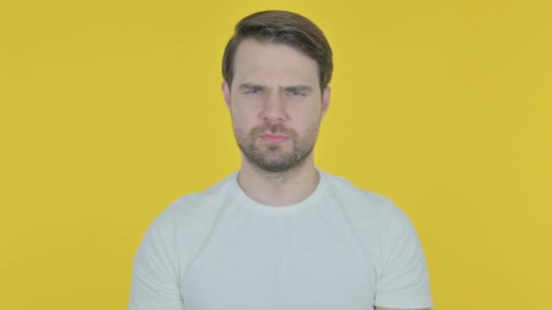 Rejecting Casual Young Man Arm Gesture Yellow Background — Αρχείο Βίντεο