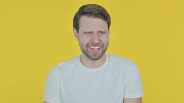 Smiling Casual Young Man Yellow Background — стоковое видео