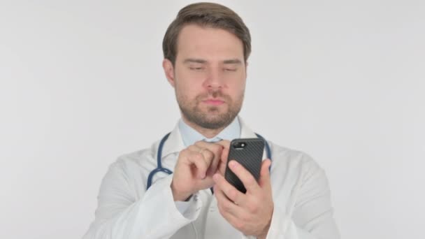 Young Adult Doctor Browsing Smartphone White Background — 图库视频影像