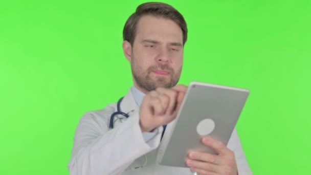 Young Adult Doctor Using Digital Tablet Green Background — Vídeo de stock