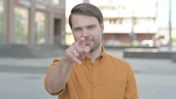 Casual Young Man Pointing Camera Outdoor — Stock videók