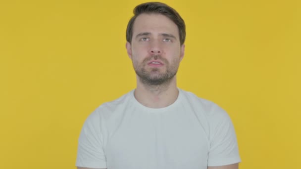 Casual Young Man Trying Listen Secret Yellow Screen — Vídeos de Stock