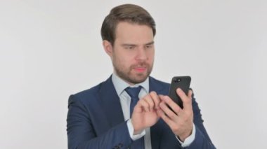 Young Adult Businessman Loss on Smartphone on White Background 