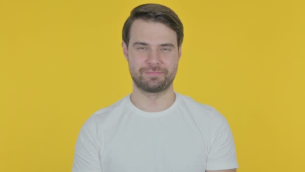 Casual Young Man Showing Heart Shape Hands Yellow Background — Vídeo de Stock