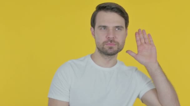 Casual Young Man Trying Listen Secret Yellow Screen — Stockvideo