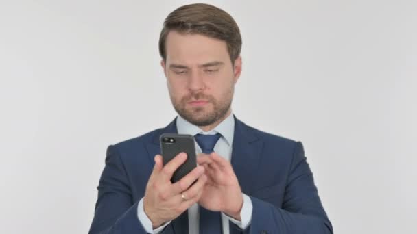 Young Adult Businessman Browsing Smartphone White Background — 图库视频影像