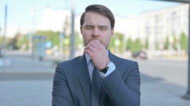 Portrait of Pensive Middle Aged Businessman Thinking Outdoor