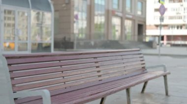 Casual Young Man Coming, Sitting on Bench and Opening Laptop