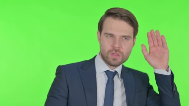 Young Adult Businessman Finger Lips Silence Green Screen — стокове відео