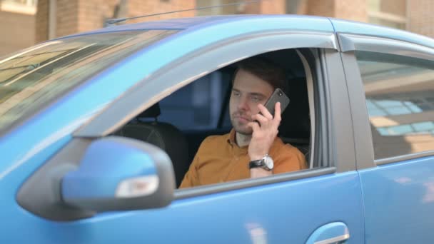 Casual Young Man Talking Phone While Sitting Car — Stockvideo