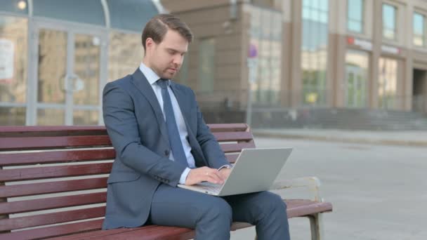Middle Aged Businessman Celebrating Success Laptop While Sitting Outdoor Bench — Stock Video