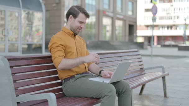 Casual Young Man Talking Video Call While Sitting Outdoor Bench — Stockvideo