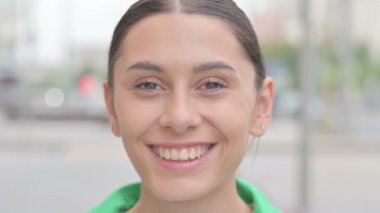 Close up of Smiling Young Woman Face Outdoor