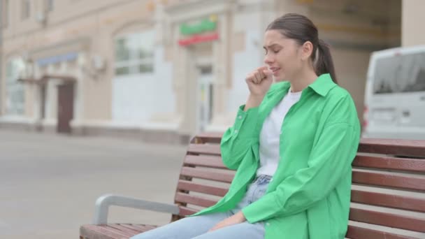 Young Woman Coughing While Sitting Bench Outdoor — Stockvideo