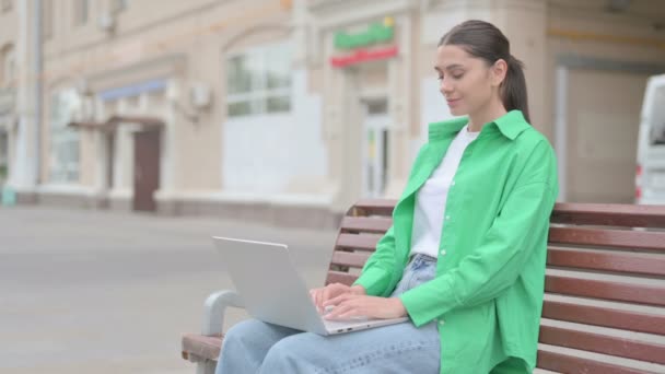 Young Woman Laptop Showing Thumbs Sign While Sitting Outdoor Bench — ストック動画