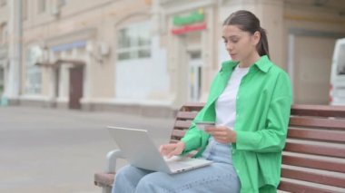 Young Woman Happy for Online Shopping on Laptop, Outdoor