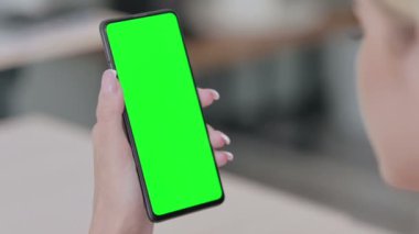 Close up of Young Woman Using Smartphone with Green Chroma Key Screen 
