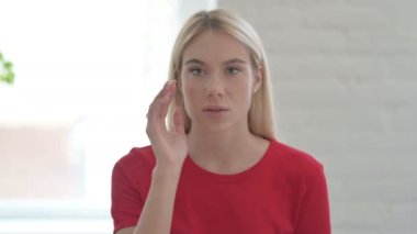 Portrait of Young Woman with Emotional Stress having Headache