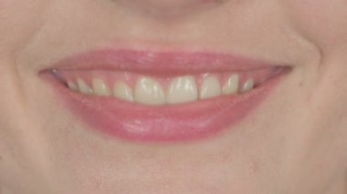 Smiling Lips of Casual Young Woman on White Background 