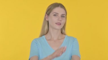 Rejecting Casual Young Woman Denying on Yellow Background 