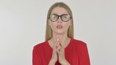 Casual Young Woman Praying with Folded Hands on White Background