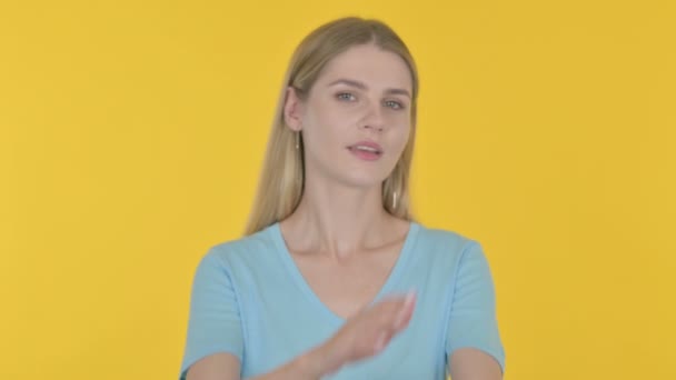 Rejecting Casual Young Woman Denying Yellow Background — Video