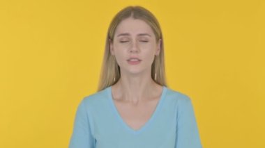 Casual Young Woman having Toothache on Yellow Background