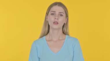 Disappointed Casual Young Woman Reacting Loss on Yellow Background 