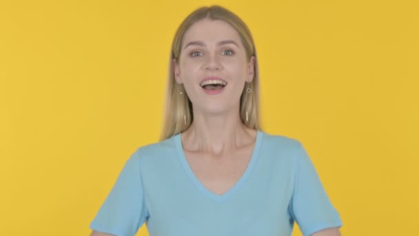 Successful Casual Young Woman Celebrating Yellow Background — Stockvideo