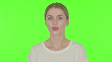 Casual Young Woman with Finger on Lips, Silence Green Screen 