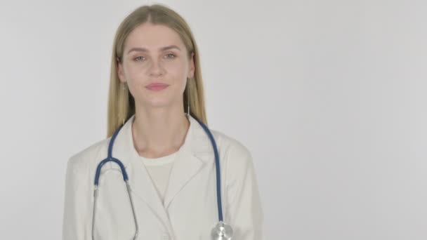 Young Female Doctor Pointing Side White Background — Stockvideo