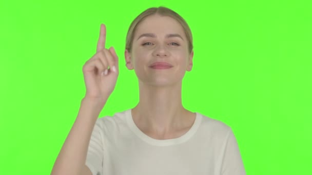 Casual Young Woman Pointing Camera Green Background — Video