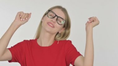 Casual Young Woman Dancing in Joy on White Background 
