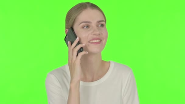Casual Young Woman Talking Phone Green Background — Stock video