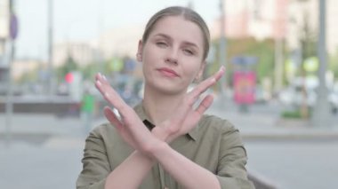 Portrait of Rejecting Young Woman Doing No Gesture Outdoor